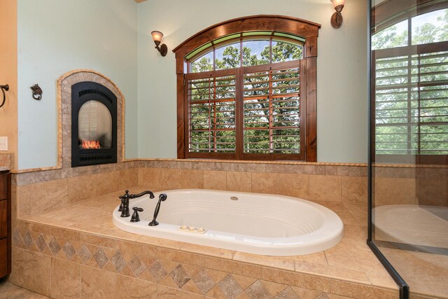 184 Appaloosa Trl, Saddlebrooke, MO 65630 - full bath with a bath and a glass covered fireplace