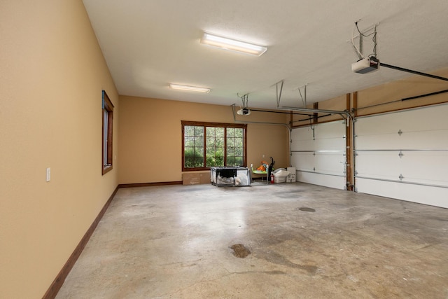 184 Appaloosa Trl, Saddlebrooke, MO 65630 - garage featuring baseboards and a garage door opener