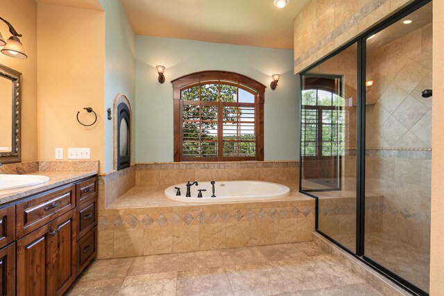 184 Appaloosa Trl, Saddlebrooke, MO 65630 - bathroom with vanity, a bath, and a shower stall