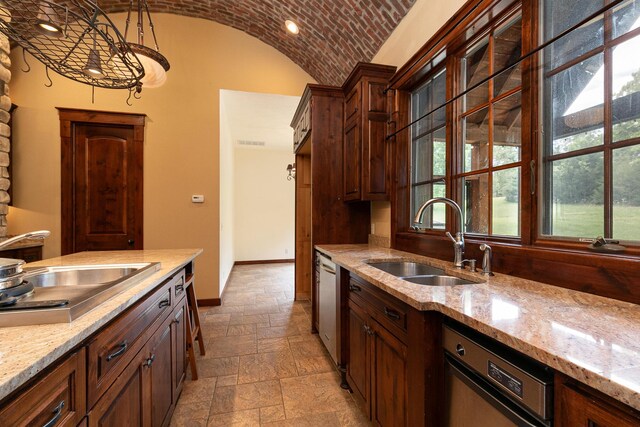 184 Appaloosa Trl, Saddlebrooke, MO 65630 - kitchen with a sink, stone tile floors, vaulted ceiling, and light stone counters