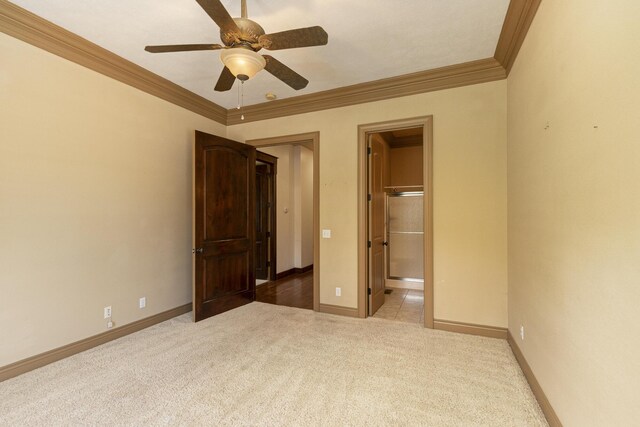 184 Appaloosa Trl, Saddlebrooke, MO 65630 - unfurnished bedroom with ornamental molding, carpet, baseboards, ensuite bathroom, and ceiling fan