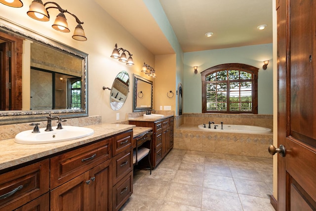 184 Appaloosa Trl, Saddlebrooke, MO 65630 - full bathroom with two vanities, a bath, and tile patterned flooring