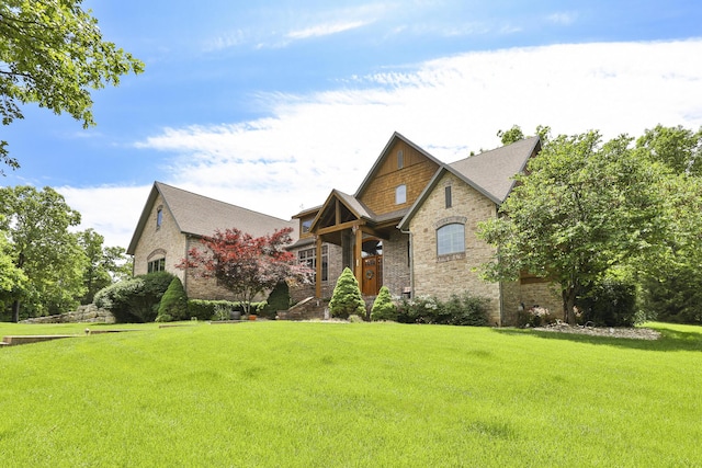 184 Appaloosa Trl, Saddlebrooke, MO 65630 - view of front of home featuring a front yard, brick siding, and stone siding