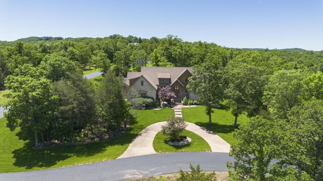 184 Appaloosa Trl, Saddlebrooke, MO 65630 - aerial view of property and surrounding area with a heavily wooded area