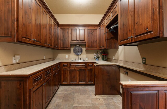 184 Appaloosa Trl, Saddlebrooke, MO 65630 - kitchen featuring stone finish floors, a sink, and light countertops