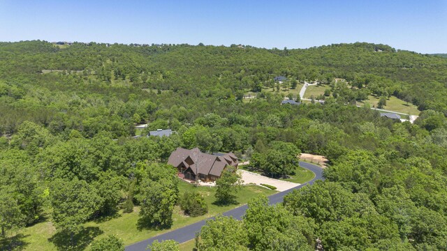 184 Appaloosa Trl, Saddlebrooke, MO 65630 - aerial overview of property's location with a heavily wooded area