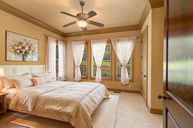 184 Appaloosa Trl, Saddlebrooke, MO 65630 - bedroom with crown molding, light carpet, baseboards, and ceiling fan