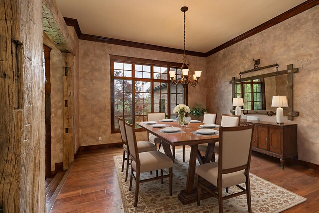 184 Appaloosa Trl, Saddlebrooke, MO 65630 - dining room featuring healthy amount of natural light, crown molding, hardwood / wood-style flooring, a chandelier, and baseboards