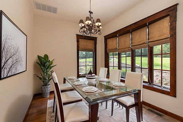 184 Appaloosa Trl, Saddlebrooke, MO 65630 - dining room featuring a chandelier, baseboards, and wood finished floors