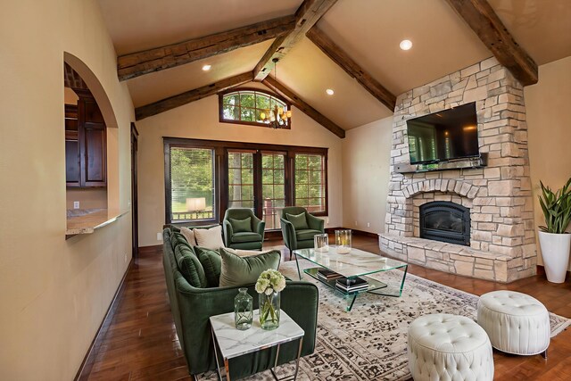 184 Appaloosa Trl, Saddlebrooke, MO 65630 - living area with dark wood finished floors, a fireplace, arched walkways, and baseboards