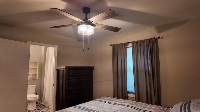 606 W Clover Dr, Clinton, MO 64735 - bedroom featuring a ceiling fan, ensuite bath, and tile patterned flooring