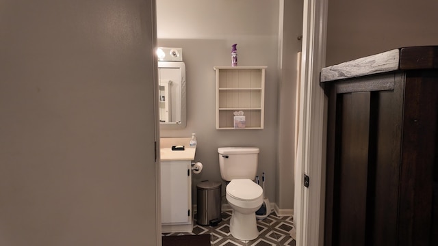 606 W Clover Dr, Clinton, MO 64735 - bathroom with vanity, toilet, and washer / dryer