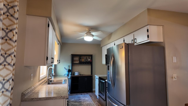 606 W Clover Dr, Clinton, MO 64735 - kitchen with a sink, range with electric cooktop, stainless steel fridge with ice dispenser, white cabinetry, and ceiling fan