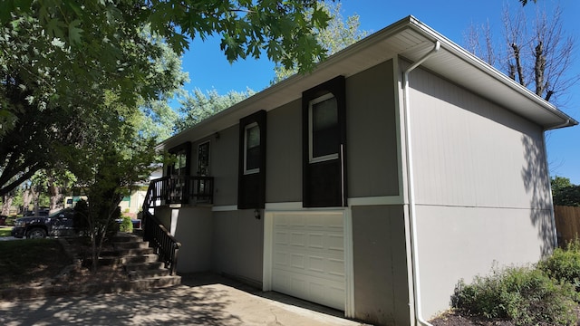 606 W Clover Dr, Clinton, MO 64735 - view of home's exterior featuring a garage