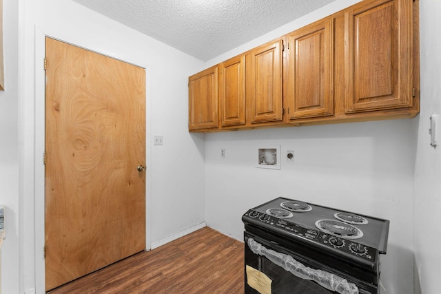 111-141 Gooseberry Ct, Branson, MO 65616 - kitchen featuring black electric range oven, dark wood-type flooring, a textured ceiling, and brown cabinets