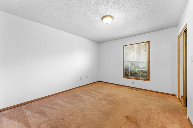 111-141 Gooseberry Ct, Branson, MO 65616 - unfurnished bedroom featuring light colored carpet, a textured ceiling, baseboards, and a closet
