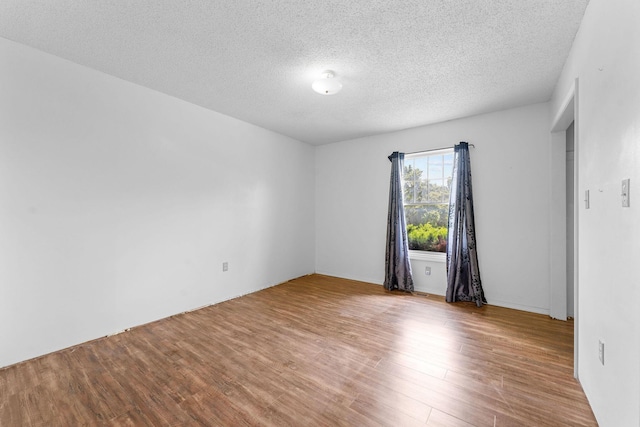 111-141 Gooseberry Ct, Branson, MO 65616 - spare room with wood finished floors and a textured ceiling