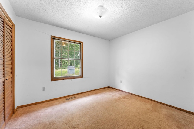 111-141 Gooseberry Ct, Branson, MO 65616 - unfurnished bedroom with carpet, a closet, a textured ceiling, and baseboards