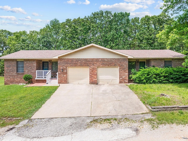 111-141 Gooseberry Ct, Branson, MO 65616 - ranch-style house with a garage, a front yard, brick siding, a porch, and concrete driveway
