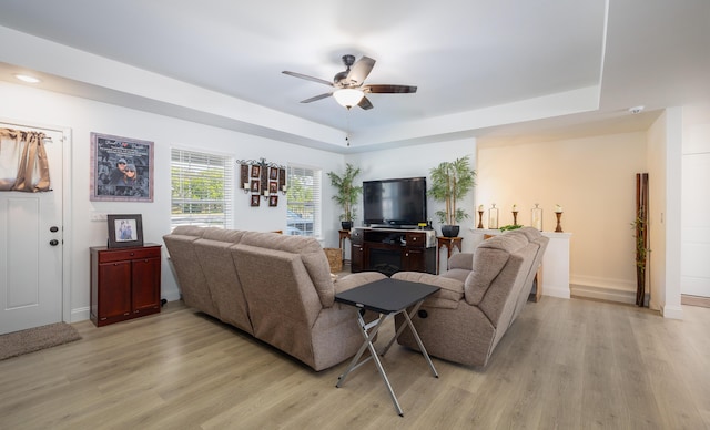 205 Seigenbein Rd, Saint Robert, MO 65584 - living area with a tray ceiling, light wood-style floors, a ceiling fan, and baseboards