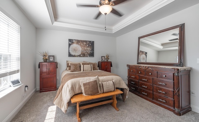 205 Seigenbein Rd, Saint Robert, MO 65584 - bedroom featuring a tray ceiling, light colored carpet, crown molding, ceiling fan, and baseboards