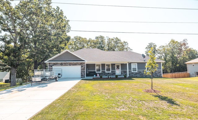205 Seigenbein Rd, Saint Robert, MO 65584 - single story home with covered porch, concrete driveway, stone siding, and an attached garage