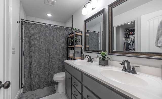 205 Seigenbein Rd, Saint Robert, MO 65584 - full bathroom with double vanity, toilet, tile patterned flooring, and a shower with shower curtain