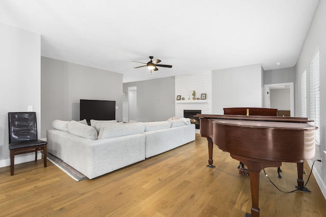 1816 N Bristol Ave, Springfield, MO 65802 - living room with ceiling fan, light wood-type flooring, and a fireplace