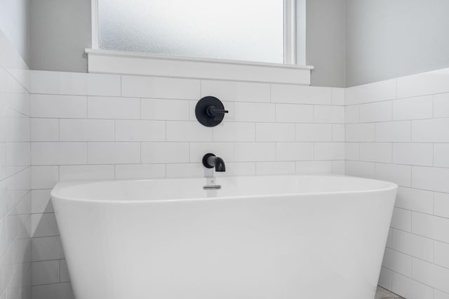 1816 N Bristol Ave, Springfield, MO 65802 - full bathroom with tile walls and a freestanding bath