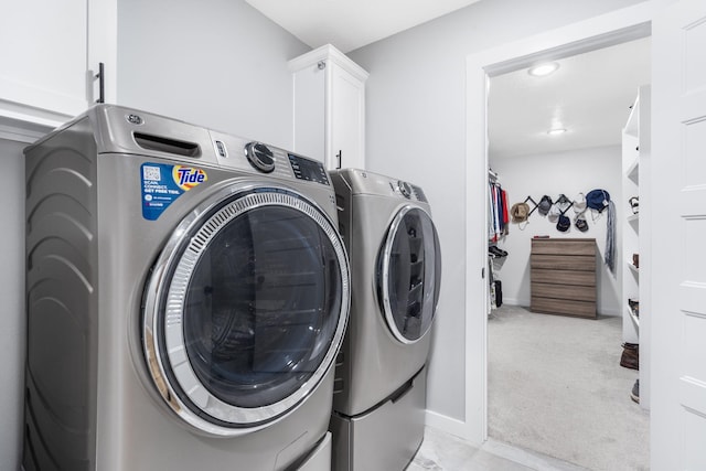 1816 N Bristol Ave, Springfield, MO 65802 - washroom featuring cabinet space, washer and clothes dryer, light carpet, and baseboards