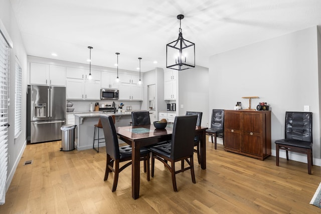 1816 N Bristol Ave, Springfield, MO 65802 - dining area featuring recessed lighting, light wood-style floors, baseboards, and a chandelier