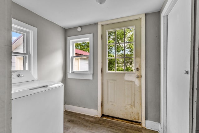 524 W Mckown St, Buffalo, MO 65622 - doorway to outside featuring washer / dryer, wood finished floors, and baseboards
