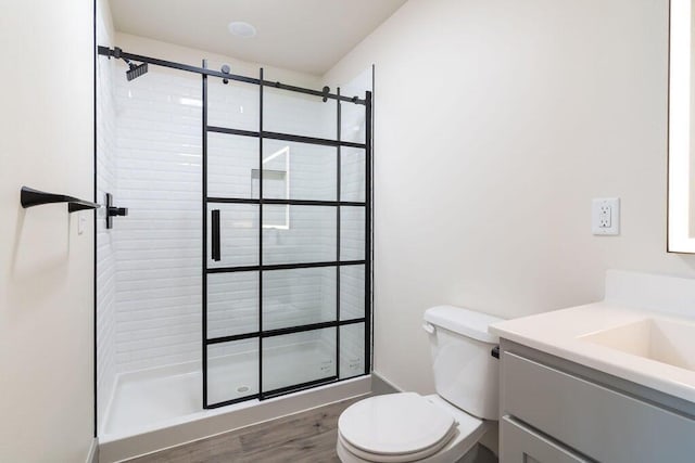 198 Michaels Dr, Hollister, MO 65672 - full bathroom with toilet, a shower stall, vanity, and wood finished floors