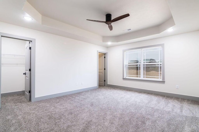 198 Michaels Dr, Hollister, MO 65672 - unfurnished room featuring carpet floors, a tray ceiling, ceiling fan, baseboards, and recessed lighting
