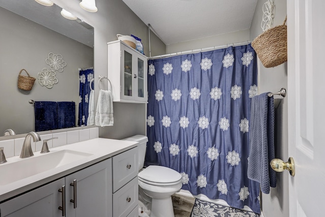 307 Azalea St, Duenweg, MO 64841 - bathroom with vanity, toilet, and wood finished floors