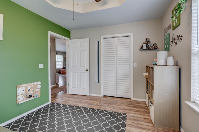 307 Azalea St, Duenweg, MO 64841 - bedroom featuring wood finished floors, a closet, baseboards, and ceiling fan