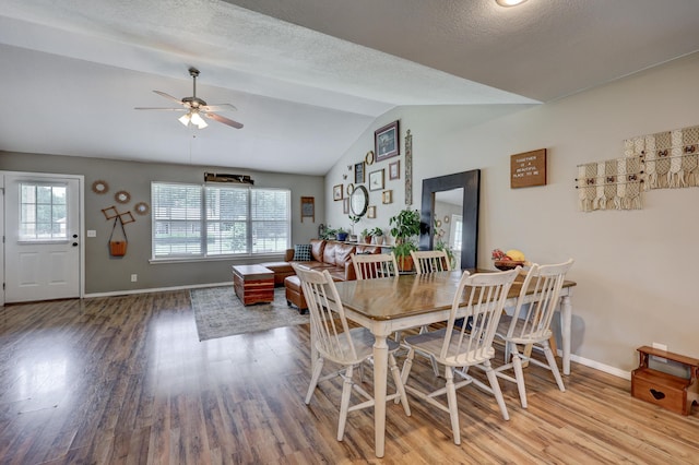 307 Azalea St, Duenweg, MO 64841 - dining area featuring wood finished floors, vaulted ceiling, ceiling fan, and baseboards