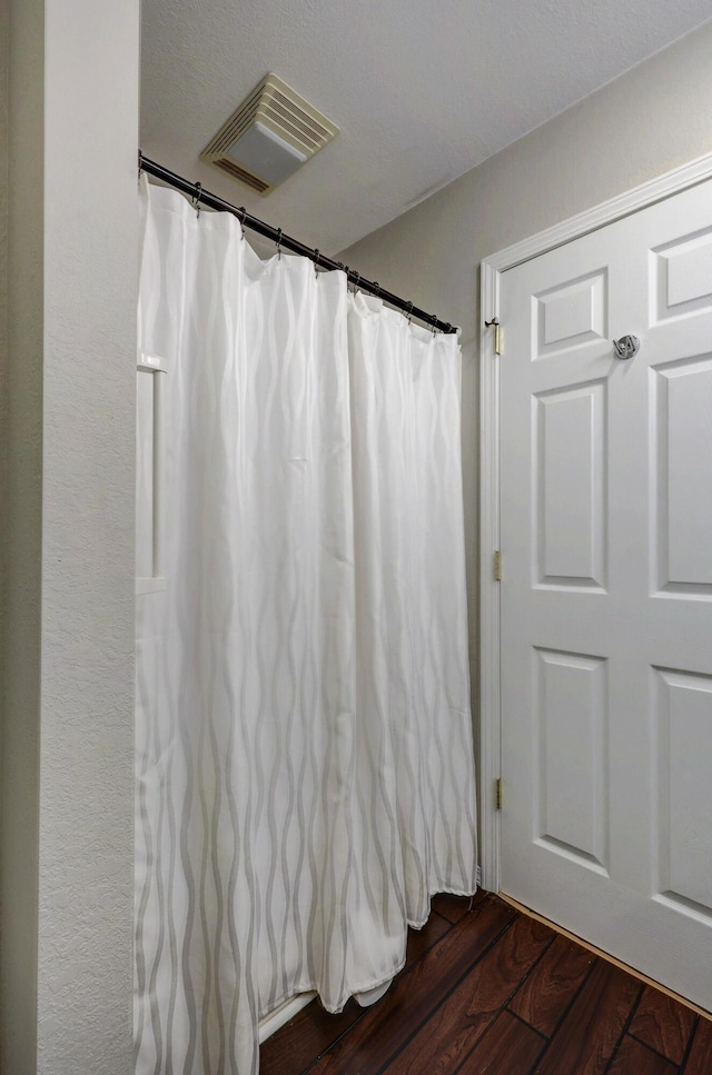 307 Azalea St, Duenweg, MO 64841 - bathroom with wood finished floors and a shower with shower curtain