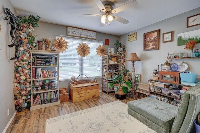307 Azalea St, Duenweg, MO 64841 - living area with ceiling fan, wood finished floors, and baseboards