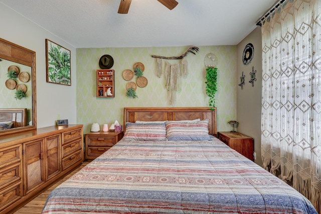 307 Azalea St, Duenweg, MO 64841 - bedroom with wallpapered walls, light wood-type flooring, and a ceiling fan