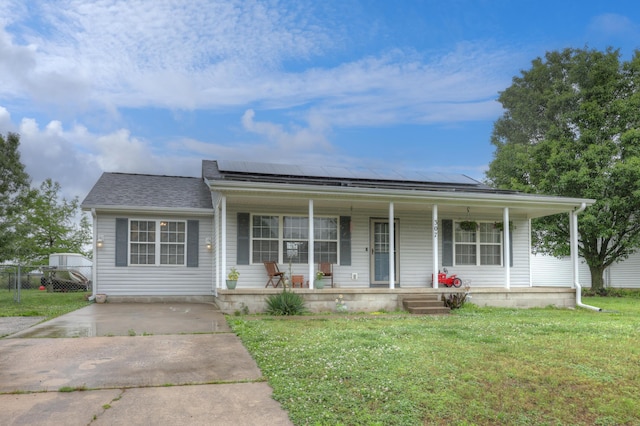 307 Azalea St, Duenweg, MO 64841 - view of front facade with a porch, a front lawn, solar panels, and roof with shingles