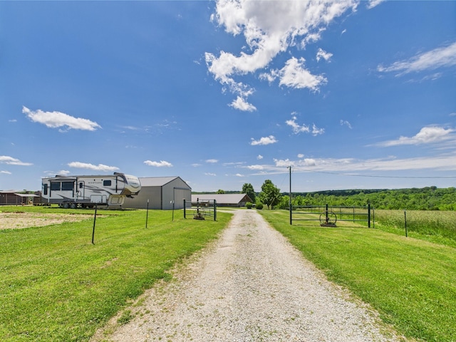 14164 Holmes Rd, Cabool, MO 65689 - view of dirt / gravel driveway with a rural view and a gated entry