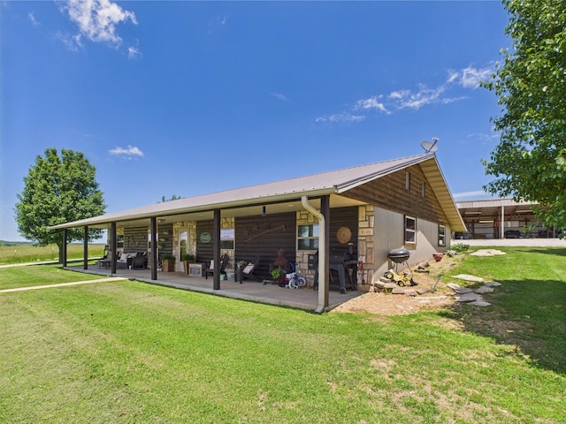 14164 Holmes Rd, Cabool, MO 65689 - back of house featuring a lawn and metal roof