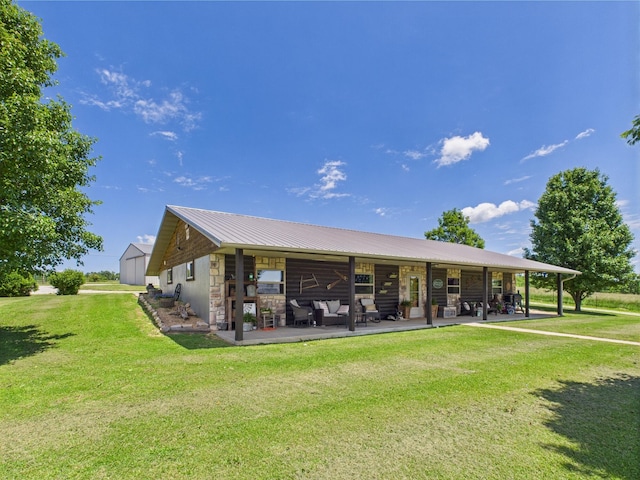 14164 Holmes Rd, Cabool, MO 65689 - back of property featuring stone siding, a yard, and metal roof
