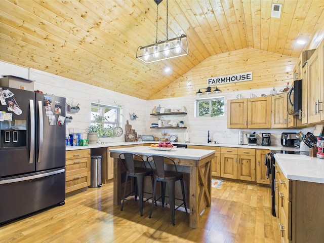14164 Holmes Rd, Cabool, MO 65689 - kitchen featuring stainless steel appliances, wooden ceiling, light countertops, light wood-style floors, and a sink