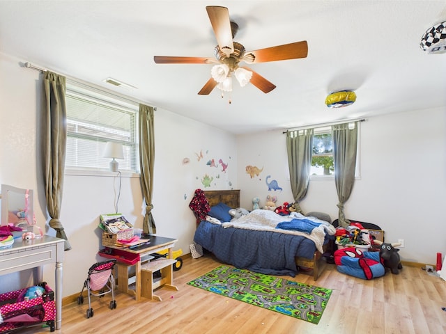 14164 Holmes Rd, Cabool, MO 65689 - bedroom featuring wood finished floors, baseboards, and ceiling fan