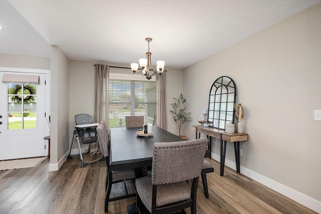 2025 Diego Ct, Bolivar, MO 65613 - dining area with a chandelier, plenty of natural light, and wood finished floors