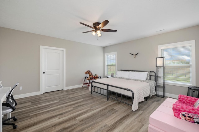 2025 Diego Ct, Bolivar, MO 65613 - bedroom featuring light wood-style floors, baseboards, and a ceiling fan