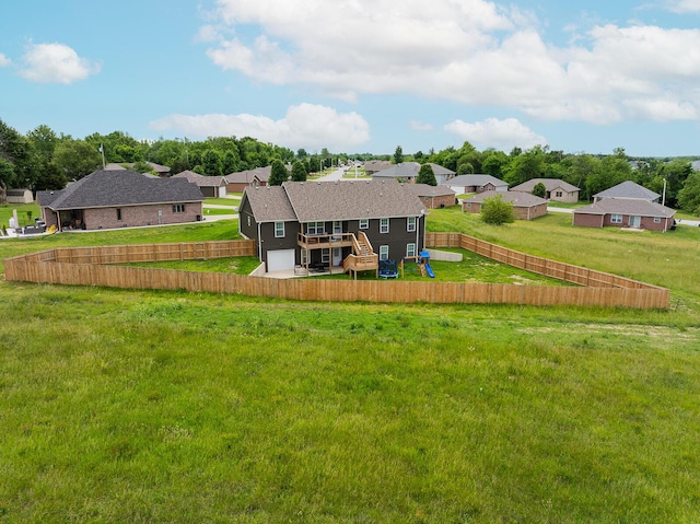 2025 Diego Ct, Bolivar, MO 65613 - rear view of house featuring a wooden deck, a fenced backyard, a residential view, and stairway