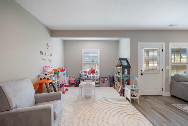 2025 Diego Ct, Bolivar, MO 65613 - game room with wood finished floors and healthy amount of natural light